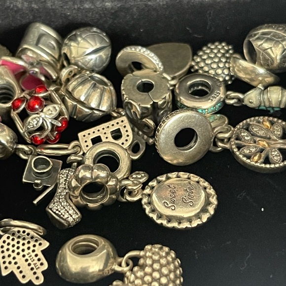 Lot of 26 Authentic Pandora charms.